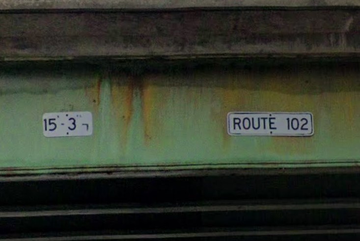 Clearance and street name on bridge
